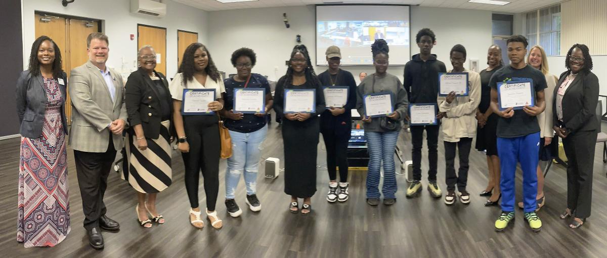 group of students holding certificates